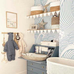 Light blue nautical style nursery with signature wallpaper